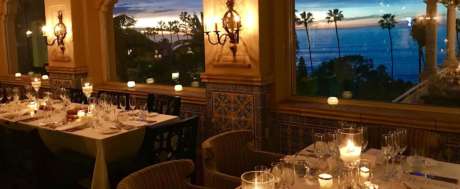 Dining table y candle light and ocean view at The Med restaurant